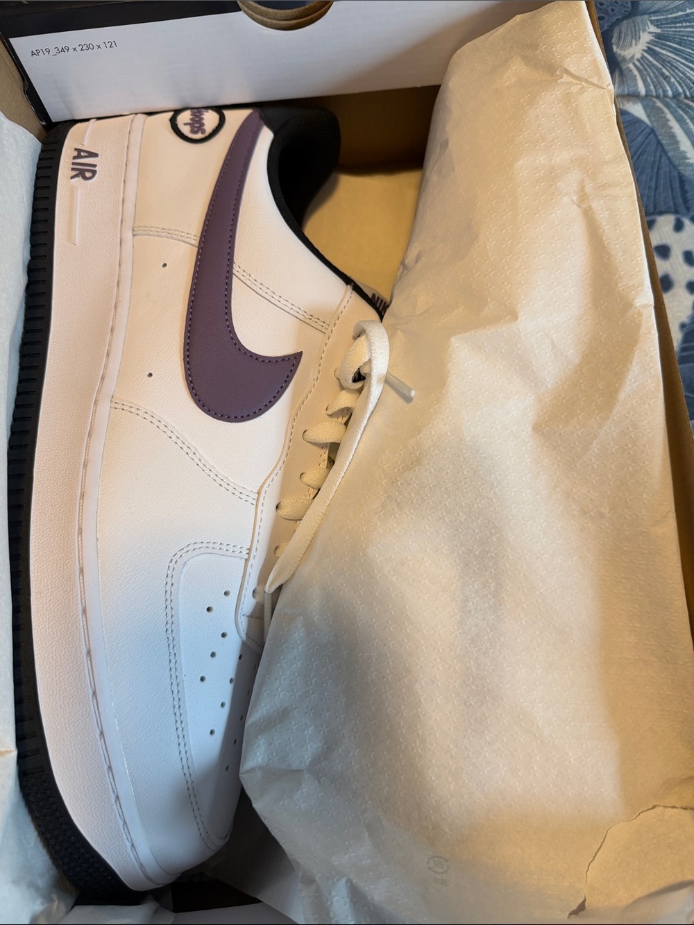 Nike White Leather Sneaker with Purple Swoosh